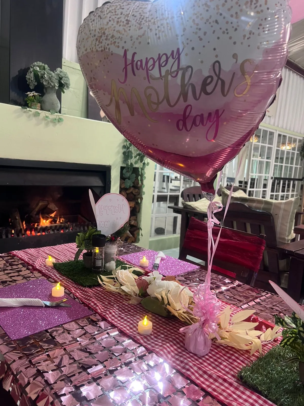 Baby shower table setting beside the Olive & Vine fireplace