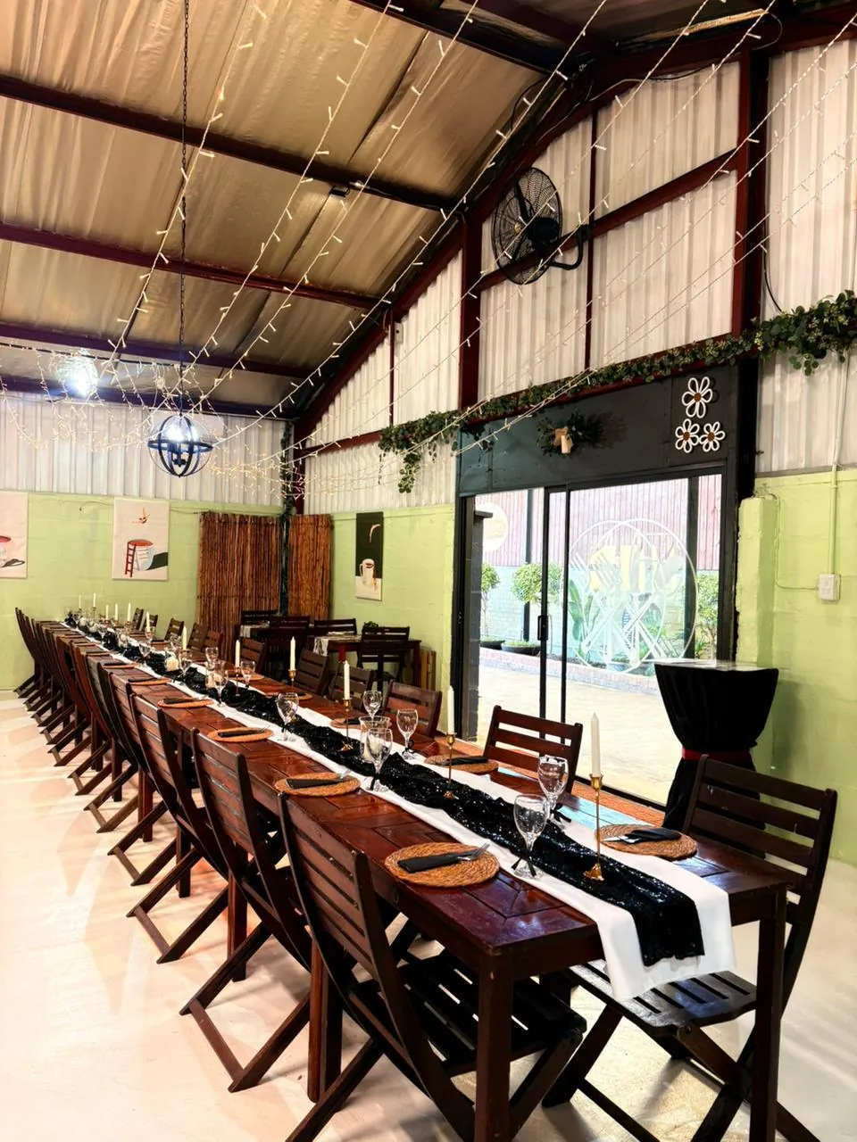 Long reception table dressed for a formal event inside Olive & Vine
