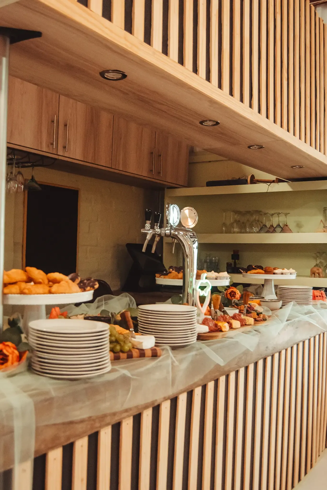 Wedding catering station with plated food, desserts and serving counter at Olive & Vine