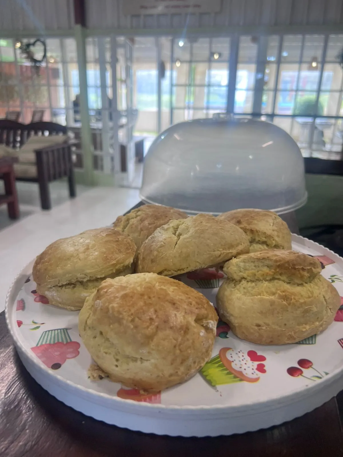 Freshly baked biscuits served on a colourful plate